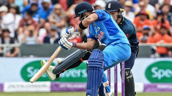 Indian cricket player batting the ball