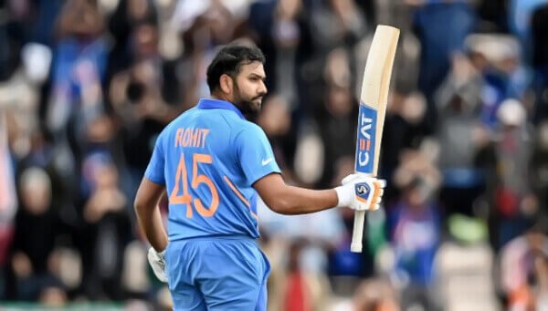 indian cricketer holding a bat